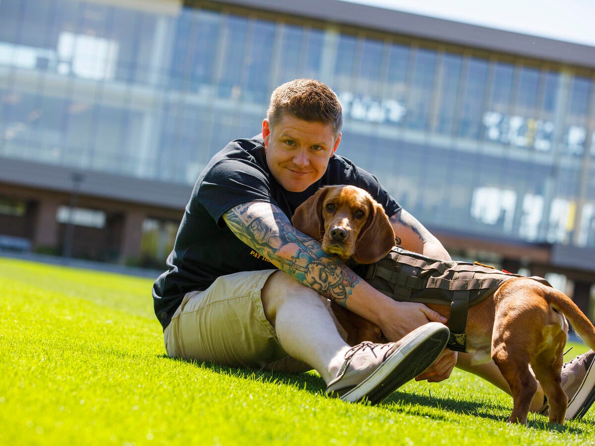 veteran student with dog